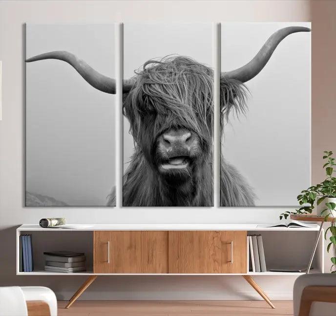 Texas Cow Wall Art Canvas Print in black and white, featuring a long-horned Highland cow, printed on museum-quality canvas with UV protection. It's perfect for enhancing any sophisticated space.