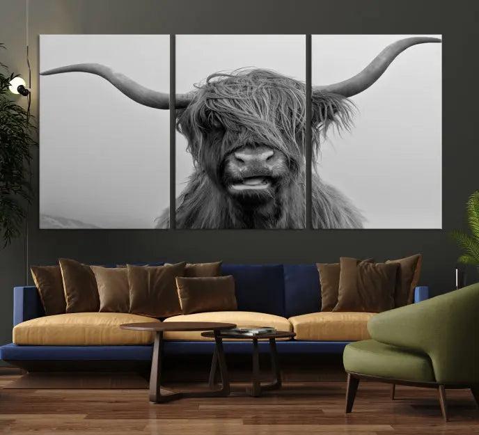 Texas Cow Wall Art Canvas Print in black and white, featuring a long-horned Highland cow, printed on museum-quality canvas with UV protection. It's perfect for enhancing any sophisticated space.