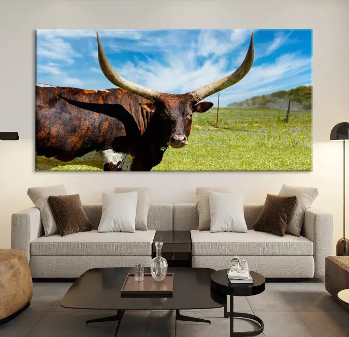 The Texas Longhorn Cow Wall Art Animal Canvas Print is a three-panel portrayal of a longhorn cow in a grassy field on museum-quality canvas with UV-protective coating.