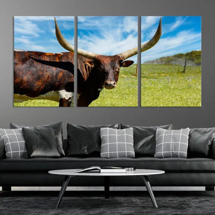 The Texas Longhorn Cow Wall Art Animal Canvas Print is a three-panel portrayal of a longhorn cow in a grassy field on museum-quality canvas with UV-protective coating.