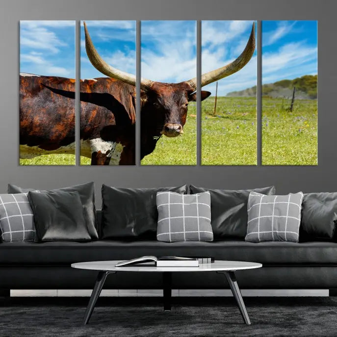 The Texas Longhorn Cow Wall Art Animal Canvas Print is a three-panel portrayal of a longhorn cow in a grassy field on museum-quality canvas with UV-protective coating.