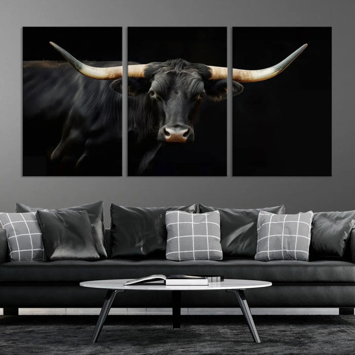 The living room exudes rustic charm with the Majestic Black Bull Wall Art Canvas Print, showcasing a Texas Longhorn cow with large horns.