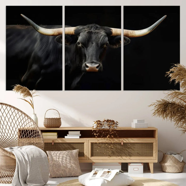 The living room exudes rustic charm with the Majestic Black Bull Wall Art Canvas Print, showcasing a Texas Longhorn cow with large horns.