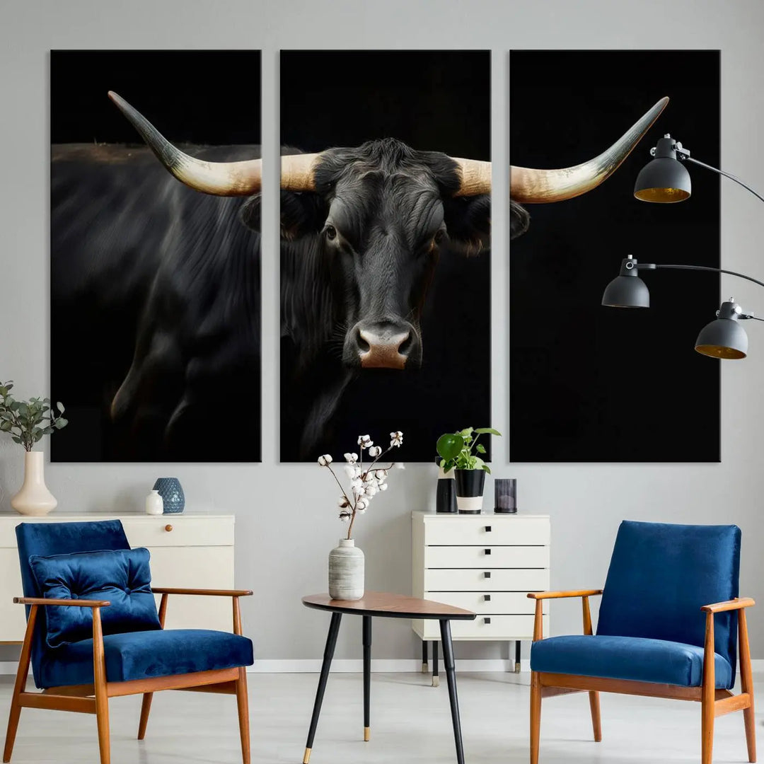 The living room exudes rustic charm with the Majestic Black Bull Wall Art Canvas Print, showcasing a Texas Longhorn cow with large horns.