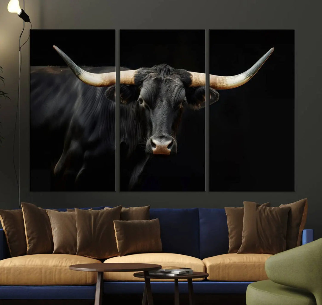 The living room exudes rustic charm with the Majestic Black Bull Wall Art Canvas Print, showcasing a Texas Longhorn cow with large horns.