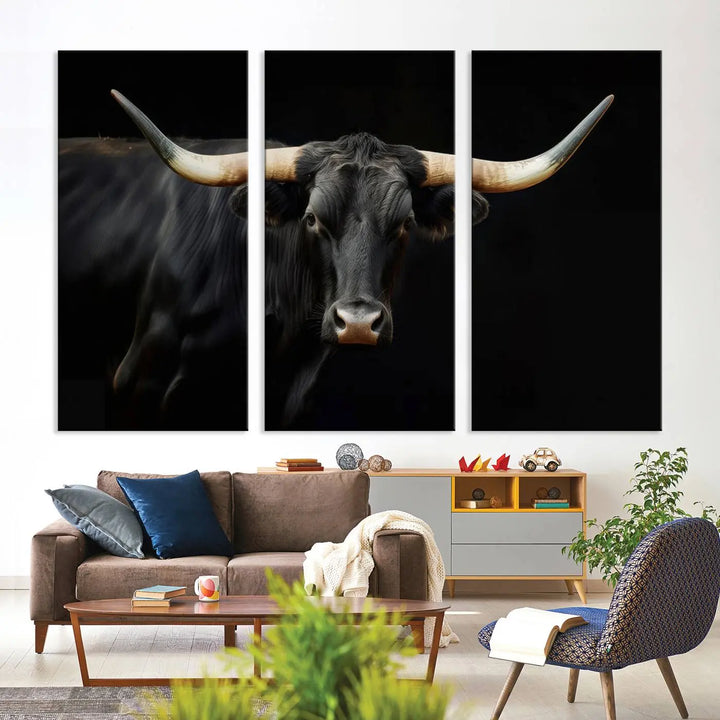 The living room exudes rustic charm with the Majestic Black Bull Wall Art Canvas Print, showcasing a Texas Longhorn cow with large horns.