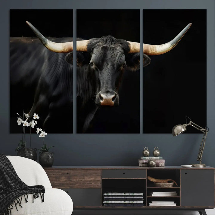 The living room exudes rustic charm with the Majestic Black Bull Wall Art Canvas Print, showcasing a Texas Longhorn cow with large horns.