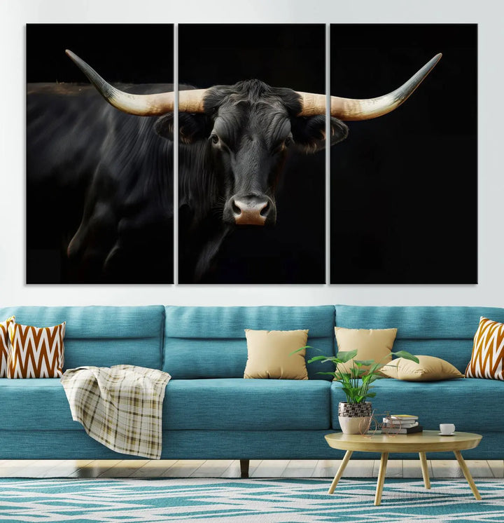 The living room exudes rustic charm with the Majestic Black Bull Wall Art Canvas Print, showcasing a Texas Longhorn cow with large horns.