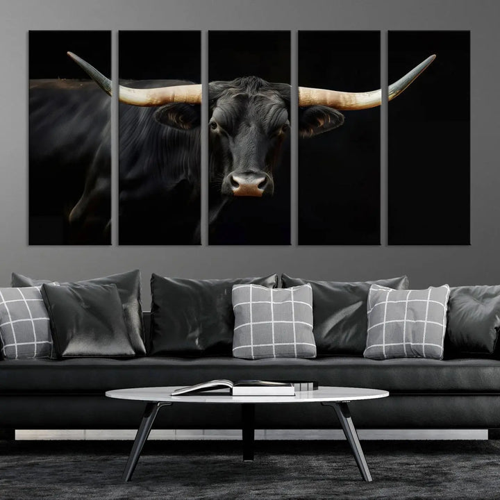 The living room exudes rustic charm with the Majestic Black Bull Wall Art Canvas Print, showcasing a Texas Longhorn cow with large horns.