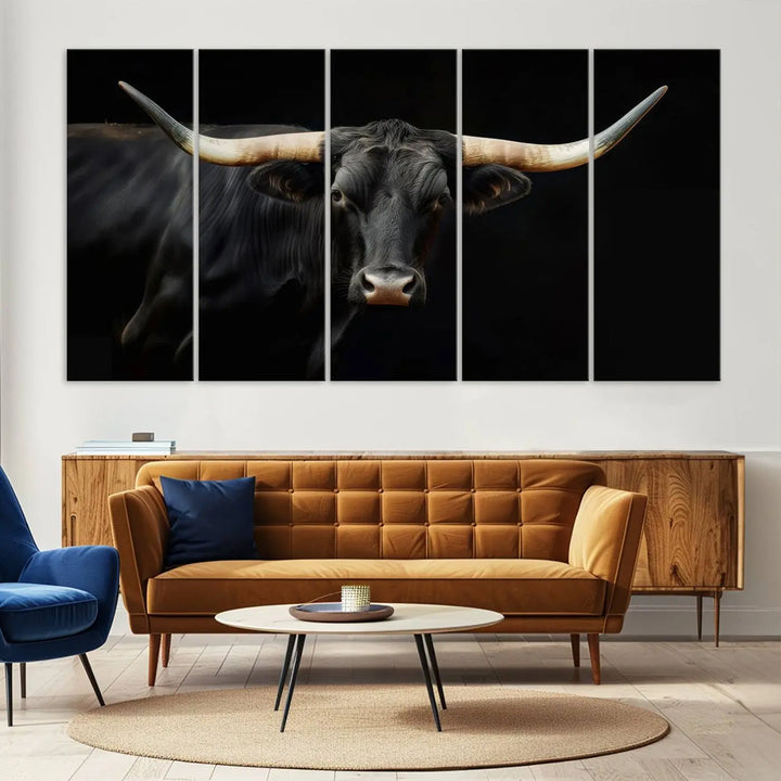 The living room exudes rustic charm with the Majestic Black Bull Wall Art Canvas Print, showcasing a Texas Longhorn cow with large horns.