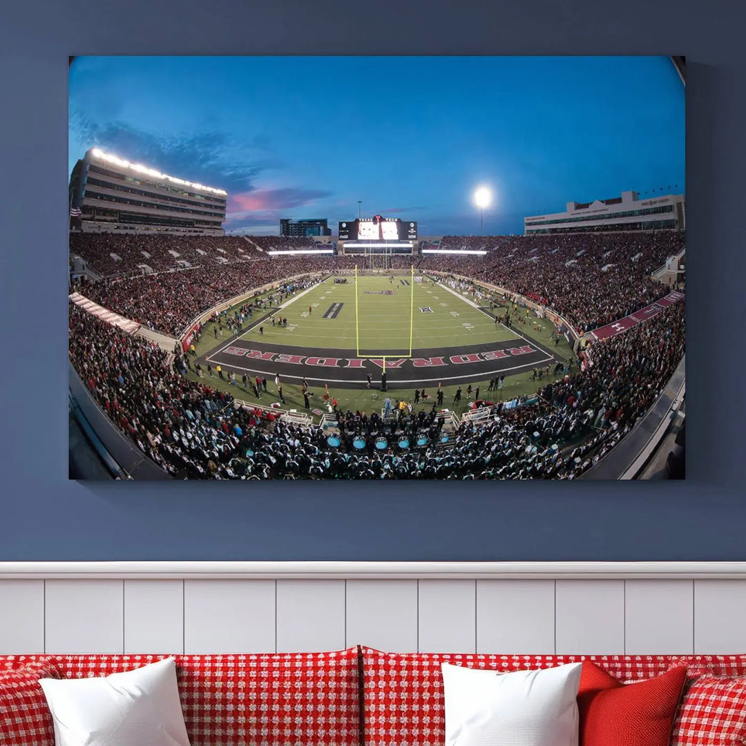 A gallery-quality triptych canvas of the Texas Tech Red Raiders football team print, showcasing Lubbock's Jones AT&T Stadium at twilight from the end zone, hangs on the wall. This stunning piece of wall art canvas print is handmade in the USA, elevating any space with its dynamic and immersive presence.