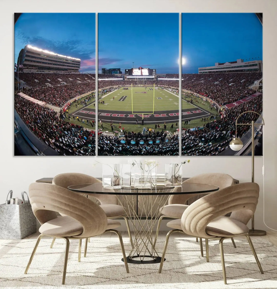 A gallery-quality triptych canvas of the Texas Tech Red Raiders football team print, showcasing Lubbock's Jones AT&T Stadium at twilight from the end zone, hangs on the wall. This stunning piece of wall art canvas print is handmade in the USA, elevating any space with its dynamic and immersive presence.