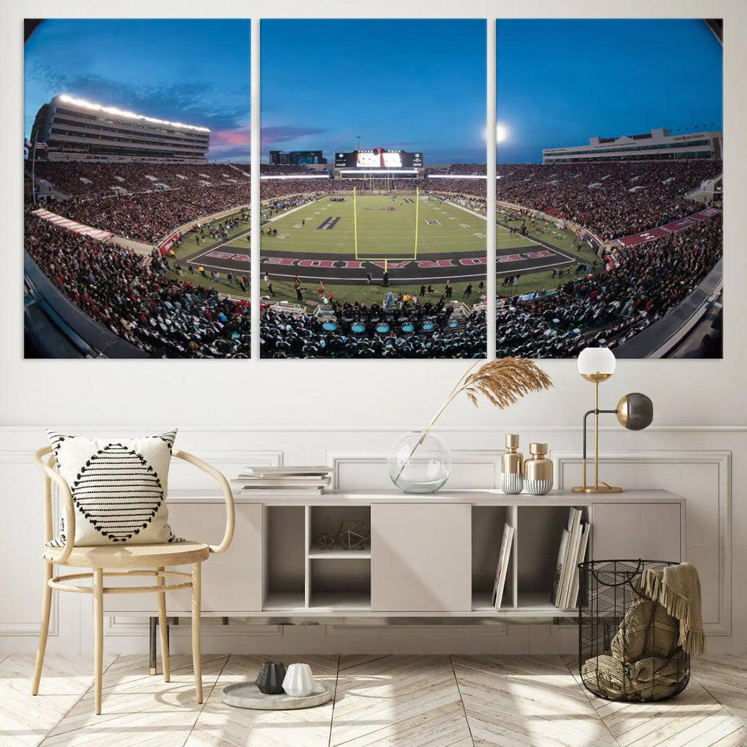 A gallery-quality triptych canvas of the Texas Tech Red Raiders football team print, showcasing Lubbock's Jones AT&T Stadium at twilight from the end zone, hangs on the wall. This stunning piece of wall art canvas print is handmade in the USA, elevating any space with its dynamic and immersive presence.