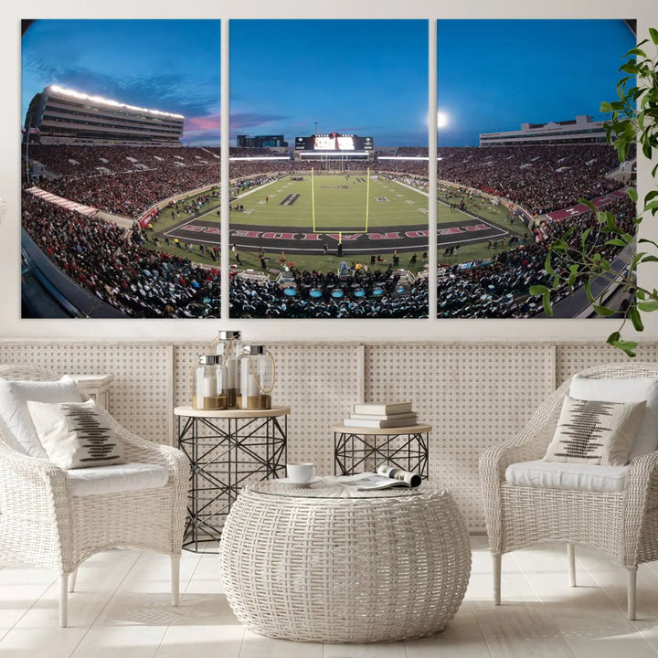 A gallery-quality triptych canvas of the Texas Tech Red Raiders football team print, showcasing Lubbock's Jones AT&T Stadium at twilight from the end zone, hangs on the wall. This stunning piece of wall art canvas print is handmade in the USA, elevating any space with its dynamic and immersive presence.