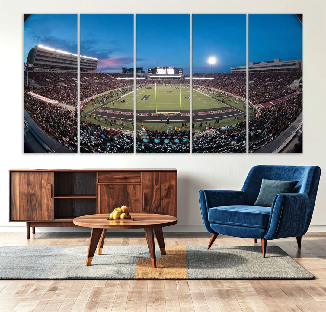 A gallery-quality triptych canvas of the Texas Tech Red Raiders football team print, showcasing Lubbock's Jones AT&T Stadium at twilight from the end zone, hangs on the wall. This stunning piece of wall art canvas print is handmade in the USA, elevating any space with its dynamic and immersive presence.