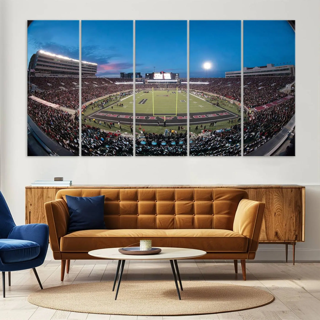 A gallery-quality triptych canvas of the Texas Tech Red Raiders football team print, showcasing Lubbock's Jones AT&T Stadium at twilight from the end zone, hangs on the wall. This stunning piece of wall art canvas print is handmade in the USA, elevating any space with its dynamic and immersive presence.