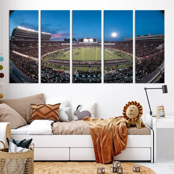 A gallery-quality triptych canvas of the Texas Tech Red Raiders football team print, showcasing Lubbock's Jones AT&T Stadium at twilight from the end zone, hangs on the wall. This stunning piece of wall art canvas print is handmade in the USA, elevating any space with its dynamic and immersive presence.