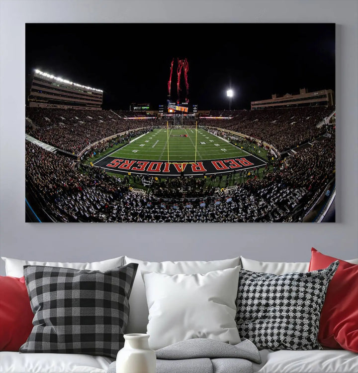 A modern living room is beautifully decorated with the "Texas Tech Red Raiders Football Team Print - Lubbock Jones AT&T Stadium Wall Art Canvas Print," showcasing a bustling football stadium. This gallery-quality canvas print exudes vibrancy and elegance.