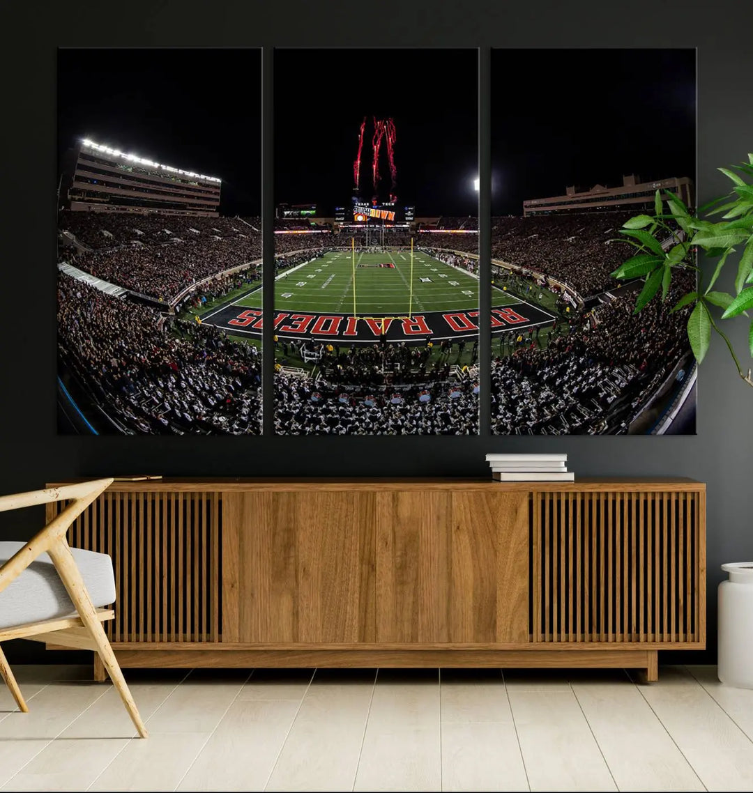 A modern living room is beautifully decorated with the "Texas Tech Red Raiders Football Team Print - Lubbock Jones AT&T Stadium Wall Art Canvas Print," showcasing a bustling football stadium. This gallery-quality canvas print exudes vibrancy and elegance.