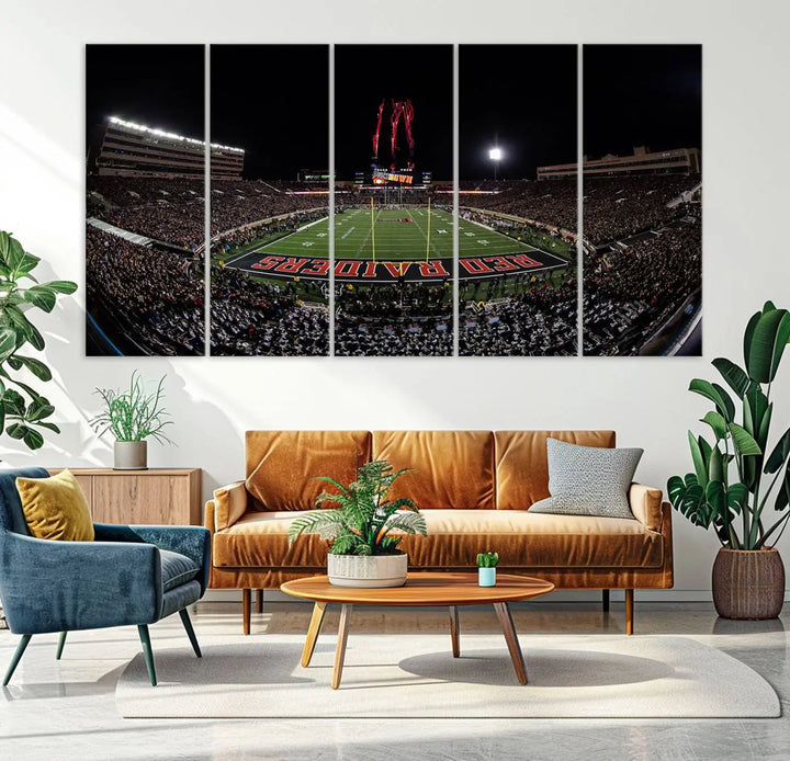 A modern living room is beautifully decorated with the "Texas Tech Red Raiders Football Team Print - Lubbock Jones AT&T Stadium Wall Art Canvas Print," showcasing a bustling football stadium. This gallery-quality canvas print exudes vibrancy and elegance.