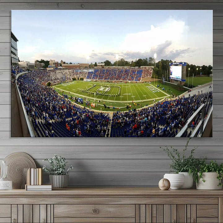 The living room showcases "The Duke University Blue Devils Football Team Print," a split-panel wall art capturing the lively atmosphere of Durham Wallace Wade Stadium. This canvas print is ready to hang and crafted to museum quality standards.