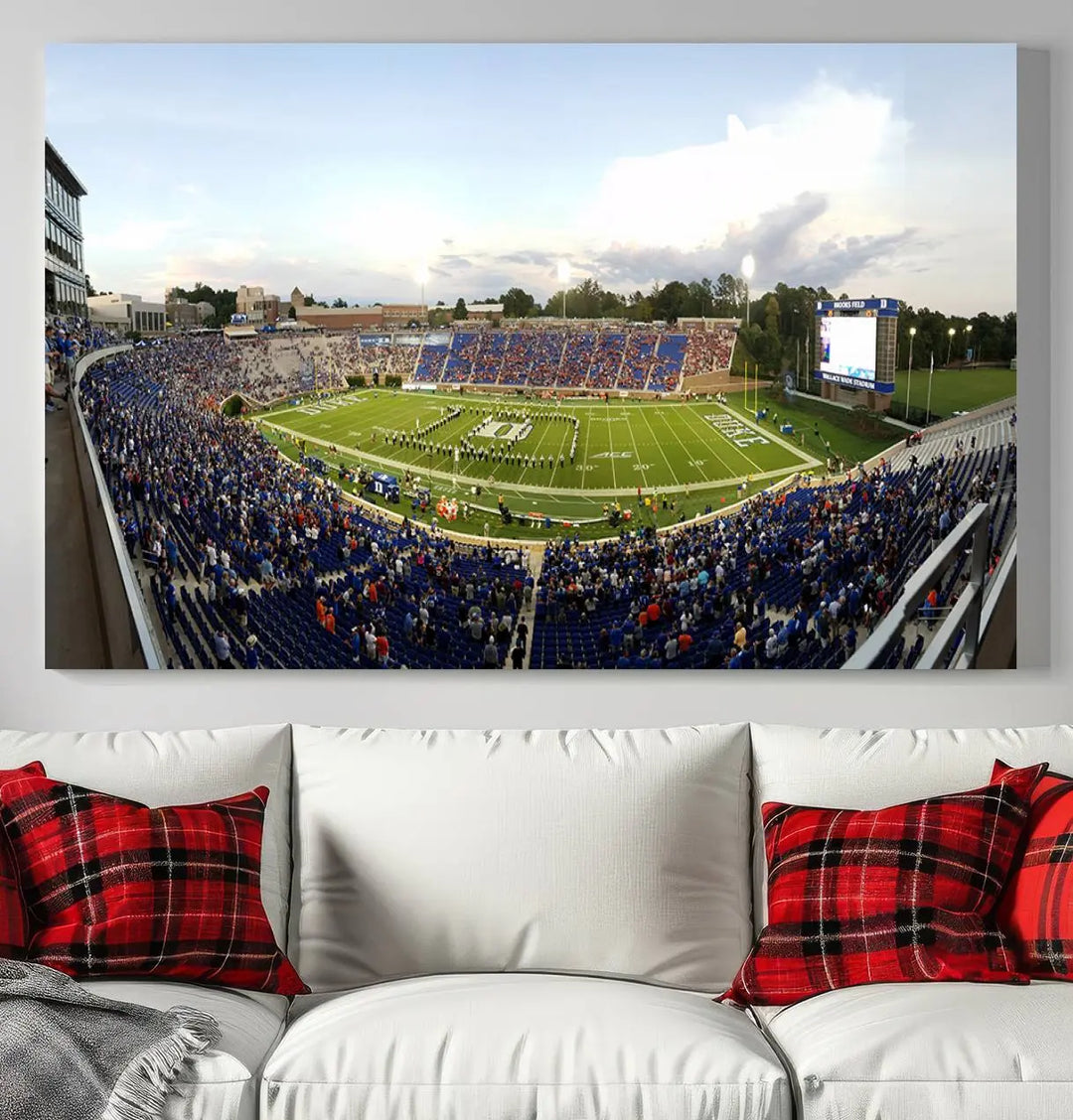 The living room showcases "The Duke University Blue Devils Football Team Print," a split-panel wall art capturing the lively atmosphere of Durham Wallace Wade Stadium. This canvas print is ready to hang and crafted to museum quality standards.