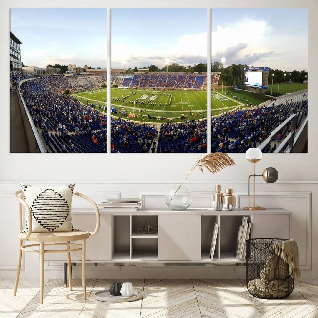 The living room showcases "The Duke University Blue Devils Football Team Print," a split-panel wall art capturing the lively atmosphere of Durham Wallace Wade Stadium. This canvas print is ready to hang and crafted to museum quality standards.