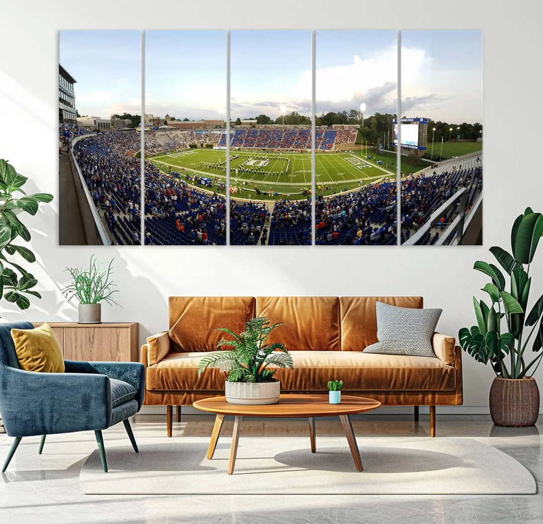 The living room showcases "The Duke University Blue Devils Football Team Print," a split-panel wall art capturing the lively atmosphere of Durham Wallace Wade Stadium. This canvas print is ready to hang and crafted to museum quality standards.