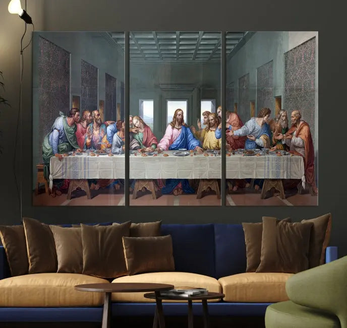 A triptych called The Last Supper Multi Panel Canvas Wall Art, printed on gallery-wrapped museum-quality polycotton canvas, is displayed in a modern living room.