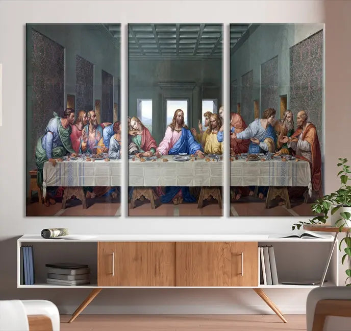 A triptych called The Last Supper Multi Panel Canvas Wall Art, printed on gallery-wrapped museum-quality polycotton canvas, is displayed in a modern living room.