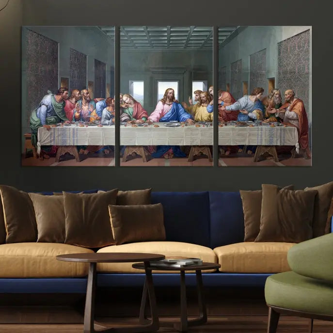 A triptych called The Last Supper Multi Panel Canvas Wall Art, printed on gallery-wrapped museum-quality polycotton canvas, is displayed in a modern living room.