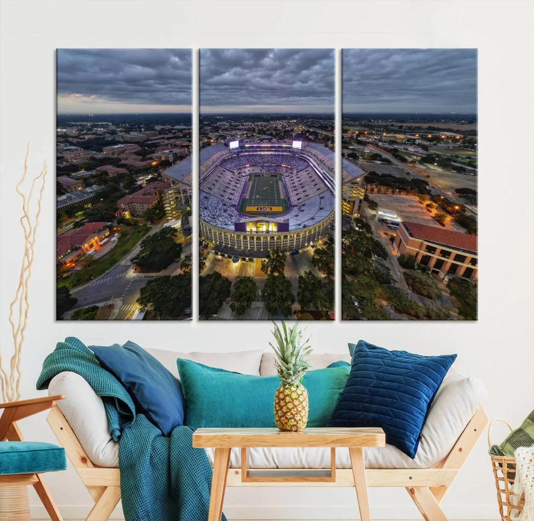 A stunning three-panel aerial view of the Louisiana State University Tigers' Tiger Stadium at dusk, set against a bustling cityscape. This captivating scene is elegantly displayed as a canvas artwork in a sleek wood frame, creating an impressive piece of wall art.