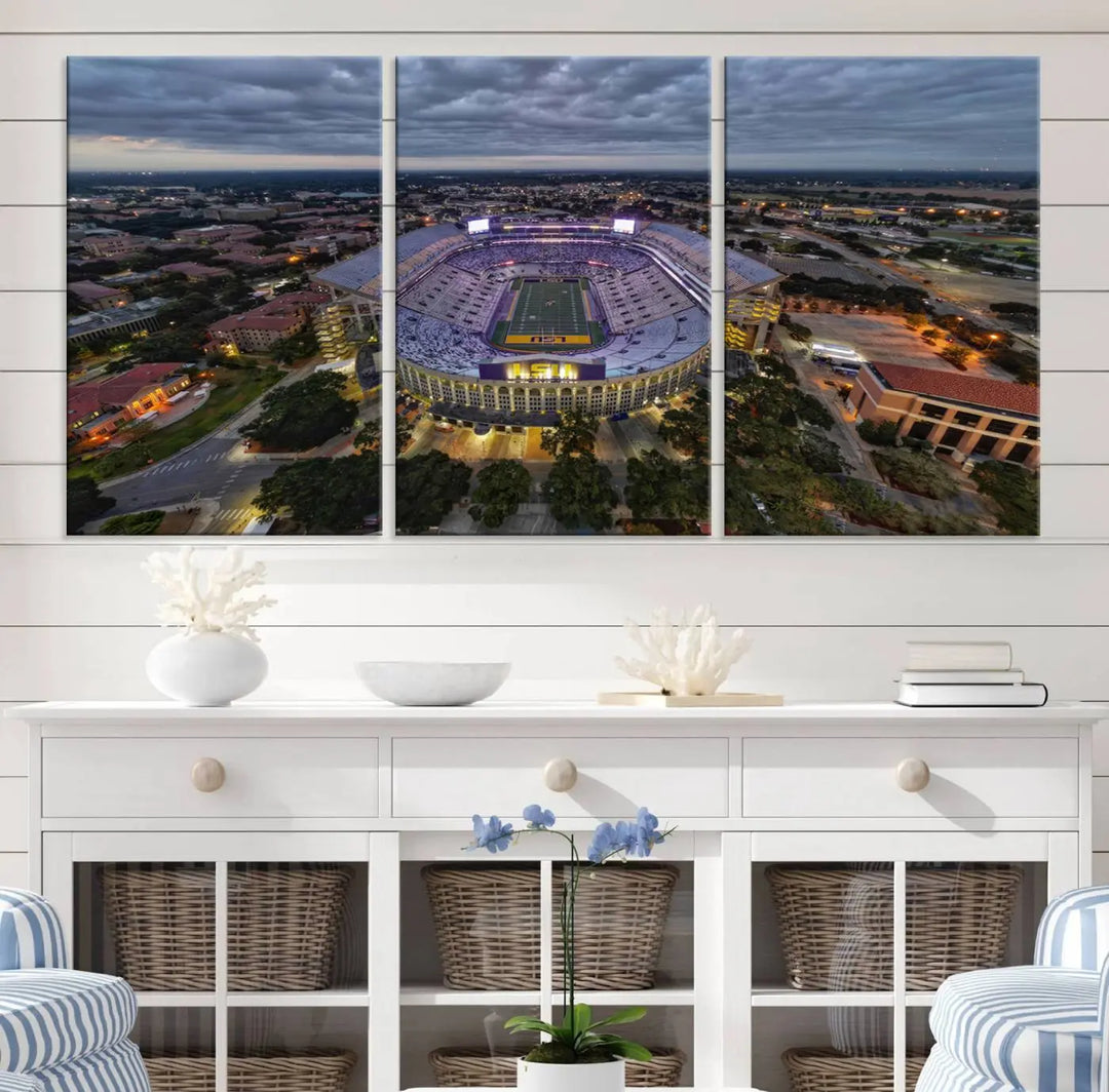 A stunning three-panel aerial view of the Louisiana State University Tigers' Tiger Stadium at dusk, set against a bustling cityscape. This captivating scene is elegantly displayed as a canvas artwork in a sleek wood frame, creating an impressive piece of wall art.