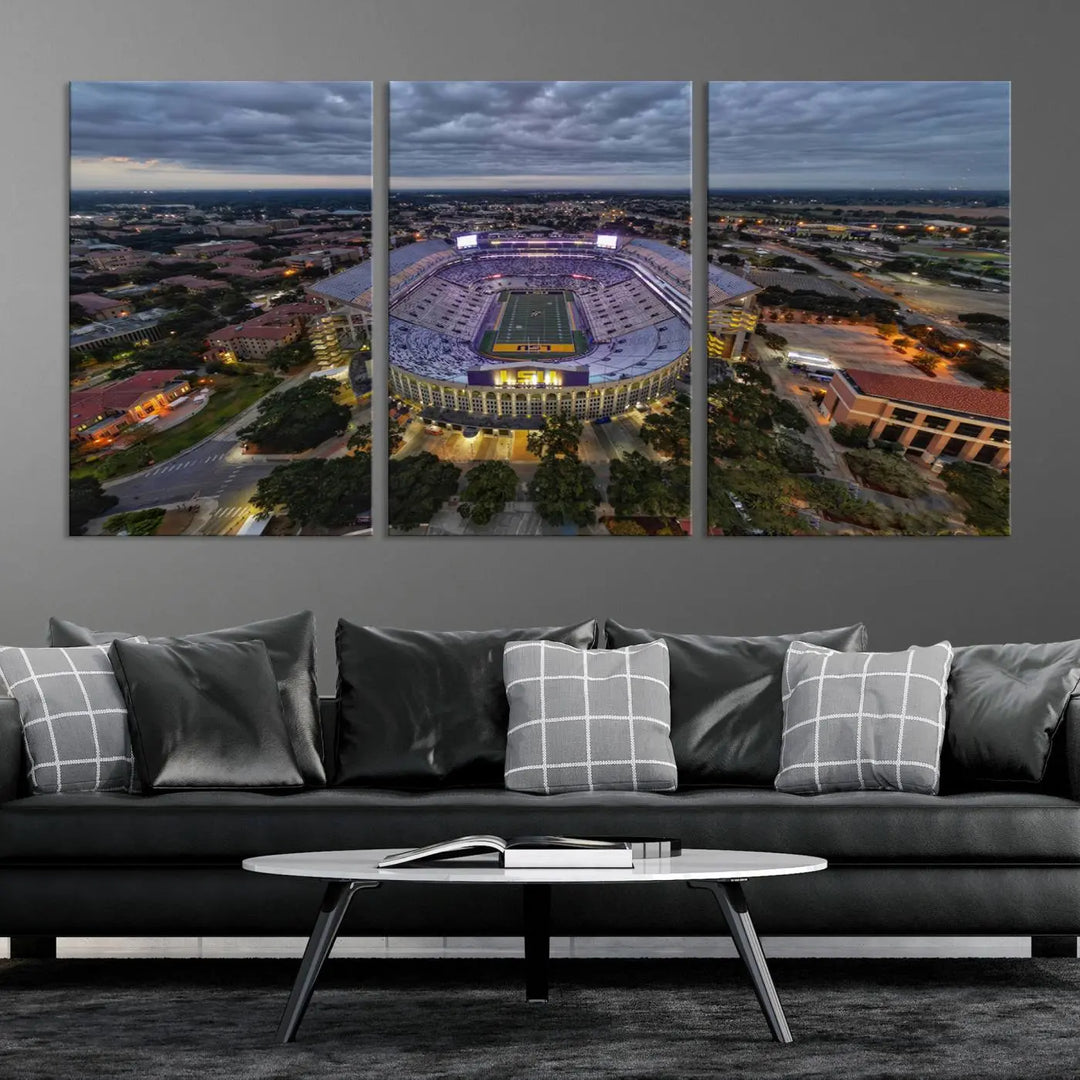 A stunning three-panel aerial view of the Louisiana State University Tigers' Tiger Stadium at dusk, set against a bustling cityscape. This captivating scene is elegantly displayed as a canvas artwork in a sleek wood frame, creating an impressive piece of wall art.