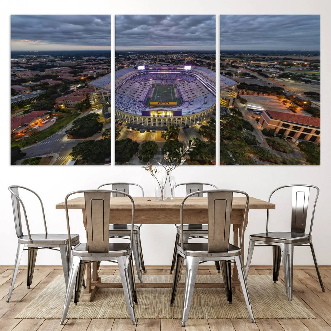 A stunning three-panel aerial view of the Louisiana State University Tigers' Tiger Stadium at dusk, set against a bustling cityscape. This captivating scene is elegantly displayed as a canvas artwork in a sleek wood frame, creating an impressive piece of wall art.