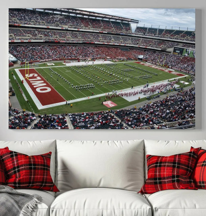 The triptych wall art depicts a vibrant sports stadium scene and captures attention. Titled "The Temple University Owls Athletics Team Print - Philadelphia Lincoln Financial Field Stadium Wall Art Canvas Print," each piece is handmade in the USA on premium canvas, adding an authentic touch to your decor.