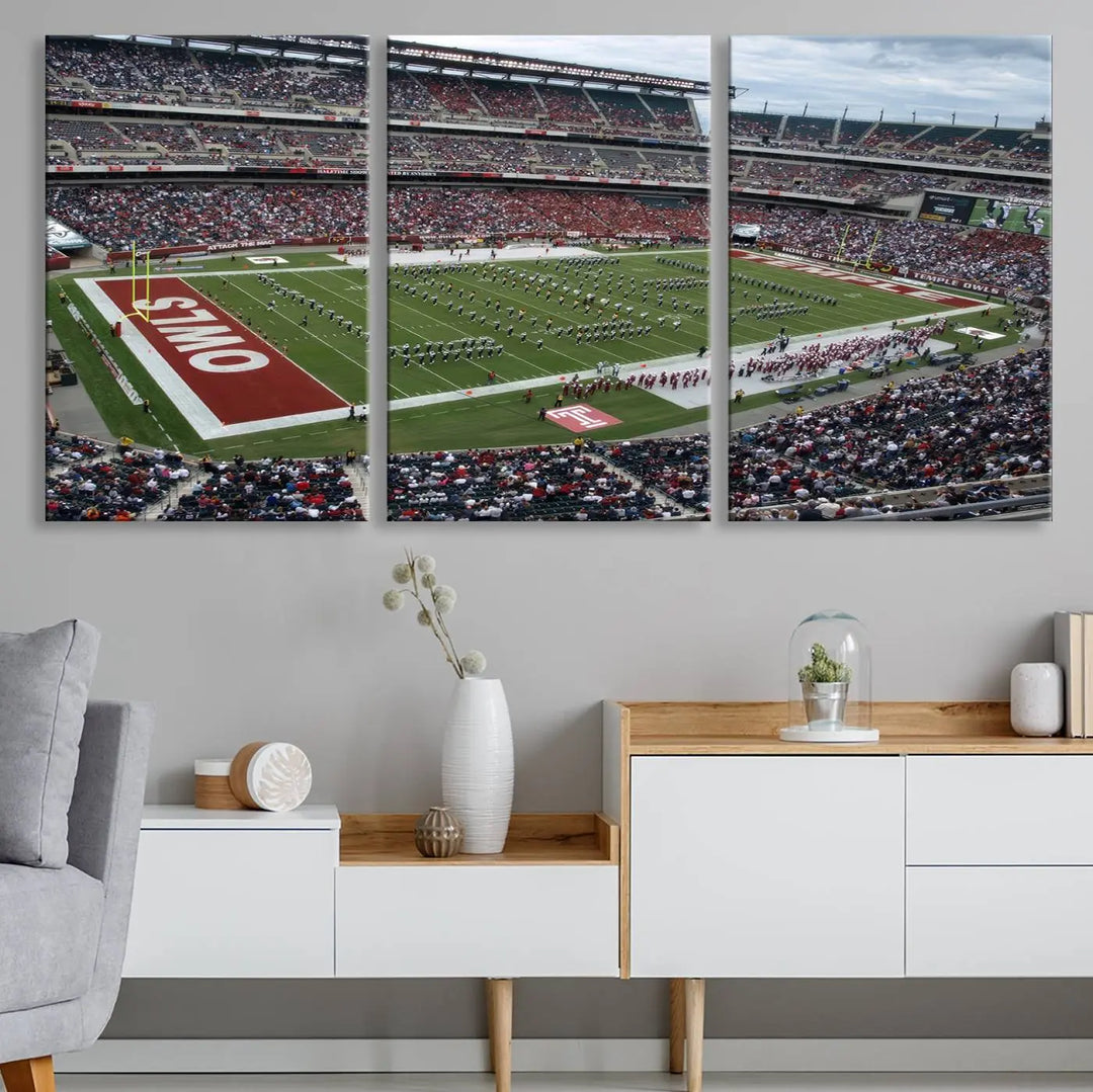 The triptych wall art depicts a vibrant sports stadium scene and captures attention. Titled "The Temple University Owls Athletics Team Print - Philadelphia Lincoln Financial Field Stadium Wall Art Canvas Print," each piece is handmade in the USA on premium canvas, adding an authentic touch to your decor.