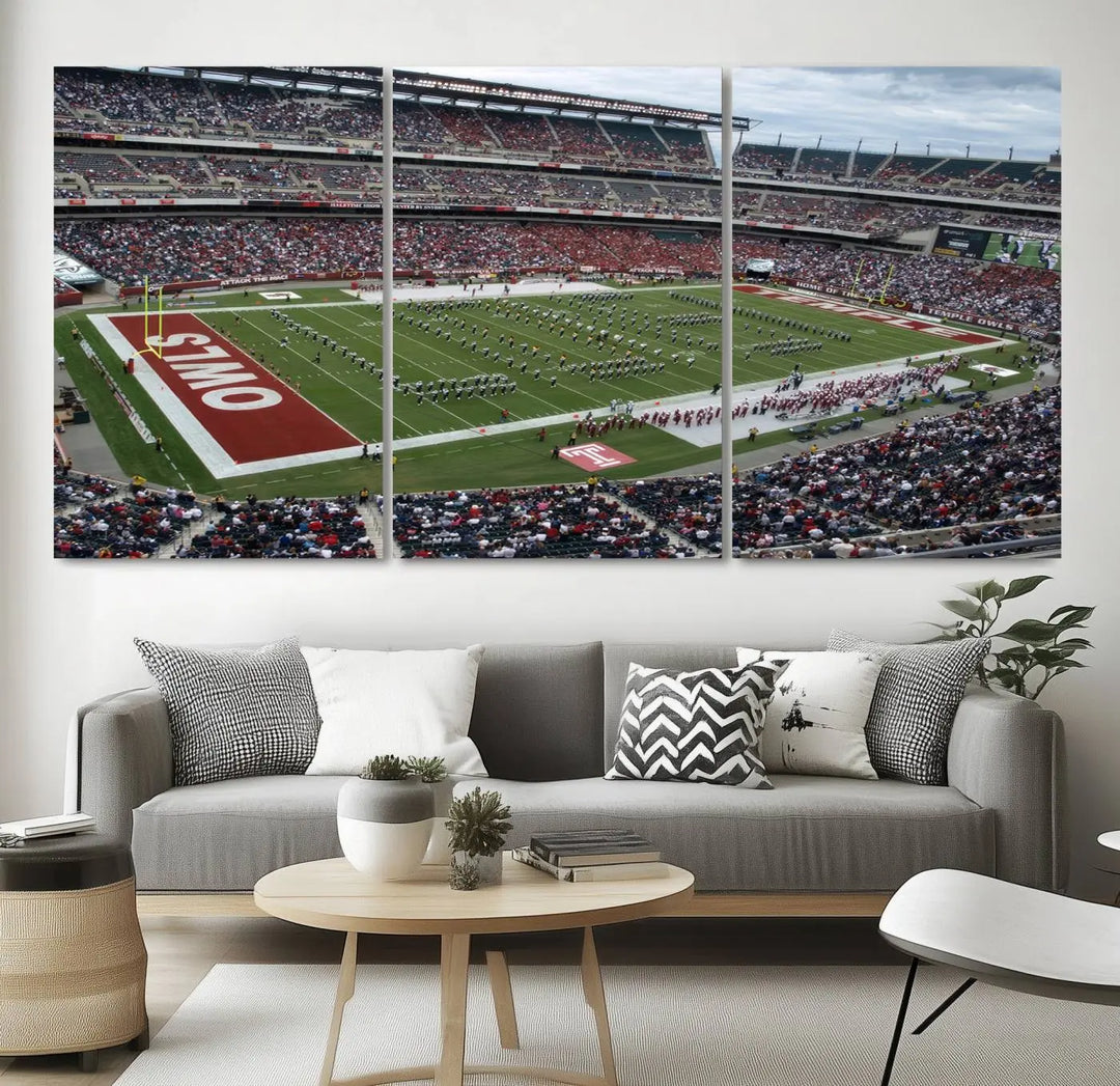 The triptych wall art depicts a vibrant sports stadium scene and captures attention. Titled "The Temple University Owls Athletics Team Print - Philadelphia Lincoln Financial Field Stadium Wall Art Canvas Print," each piece is handmade in the USA on premium canvas, adding an authentic touch to your decor.