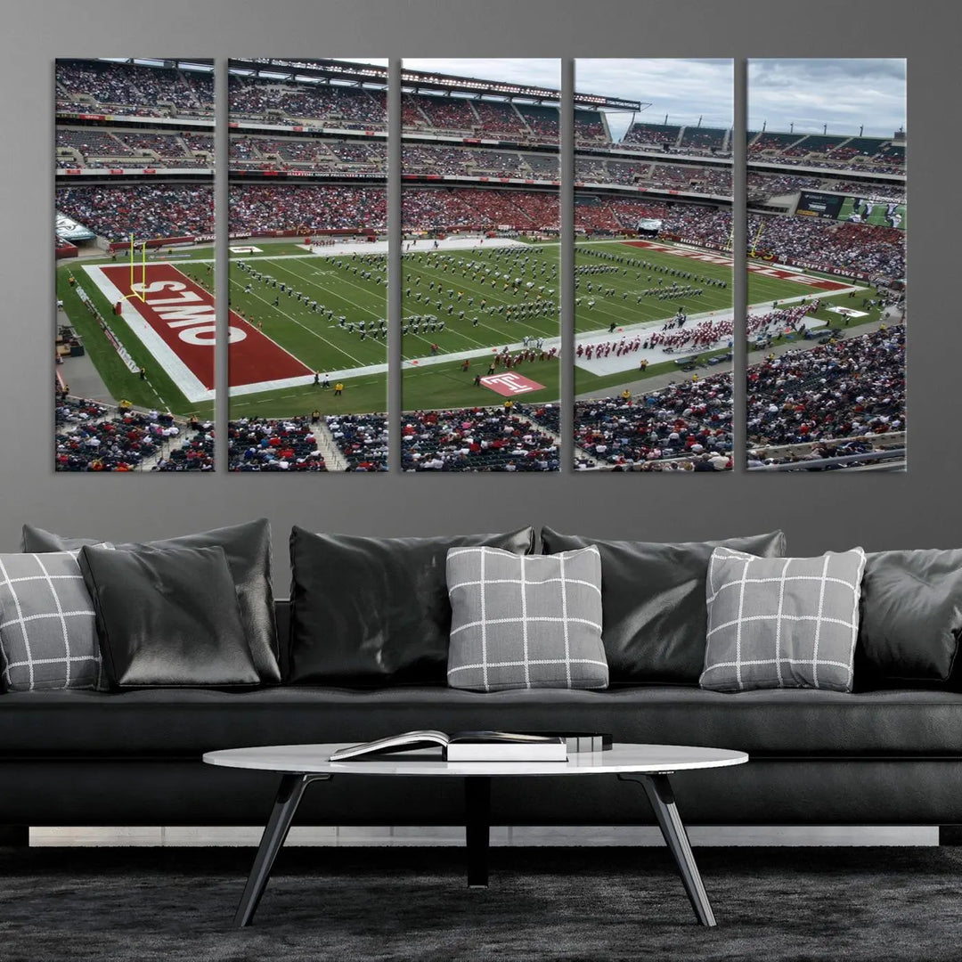 The triptych wall art depicts a vibrant sports stadium scene and captures attention. Titled "The Temple University Owls Athletics Team Print - Philadelphia Lincoln Financial Field Stadium Wall Art Canvas Print," each piece is handmade in the USA on premium canvas, adding an authentic touch to your decor.