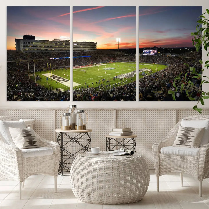 The living room is highlighted by a stunning triptych of the University of Connecticut UCONN Huskies Football Team at sunset on premium canvas, showcasing the East Hartford Pratt & Whitney Stadium.