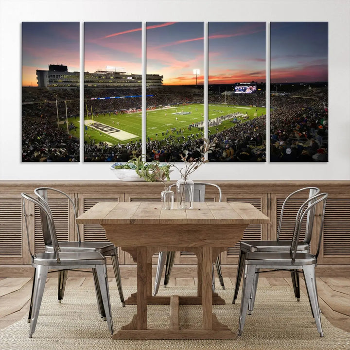 The living room is highlighted by a stunning triptych of the University of Connecticut UCONN Huskies Football Team at sunset on premium canvas, showcasing the East Hartford Pratt & Whitney Stadium.