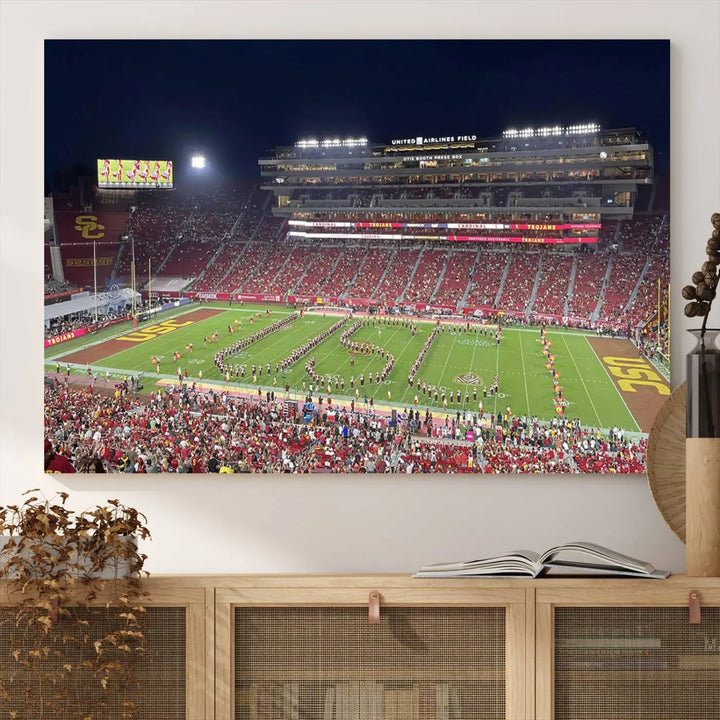 The University of Southern California USC Trojans Football Team Print - Los Angeles Memorial Coliseum Stadium Wall Art Canvas Print beautifully captures a bustling football stadium at night, featuring a marching band on the field. This piece boasts a gallery-quality finish that seamlessly complements any decor.