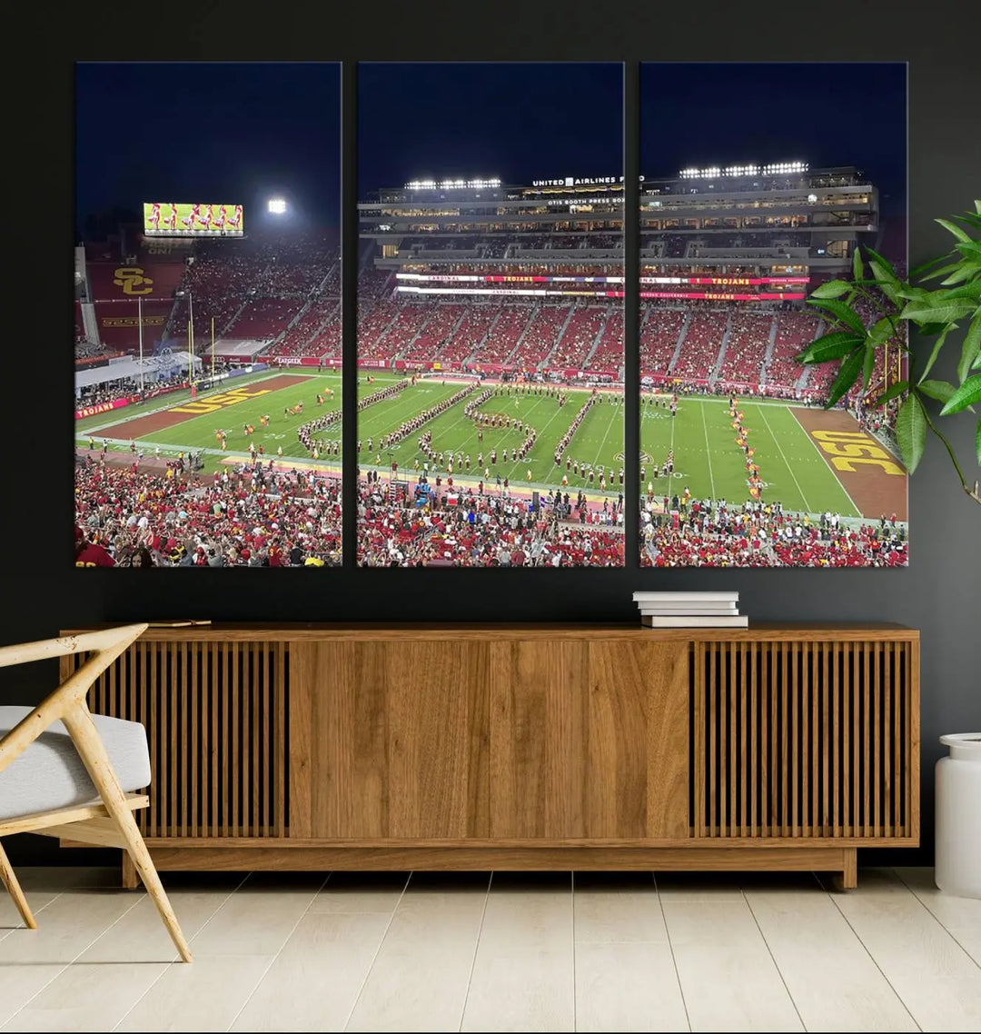 The University of Southern California USC Trojans Football Team Print - Los Angeles Memorial Coliseum Stadium Wall Art Canvas Print beautifully captures a bustling football stadium at night, featuring a marching band on the field. This piece boasts a gallery-quality finish that seamlessly complements any decor.