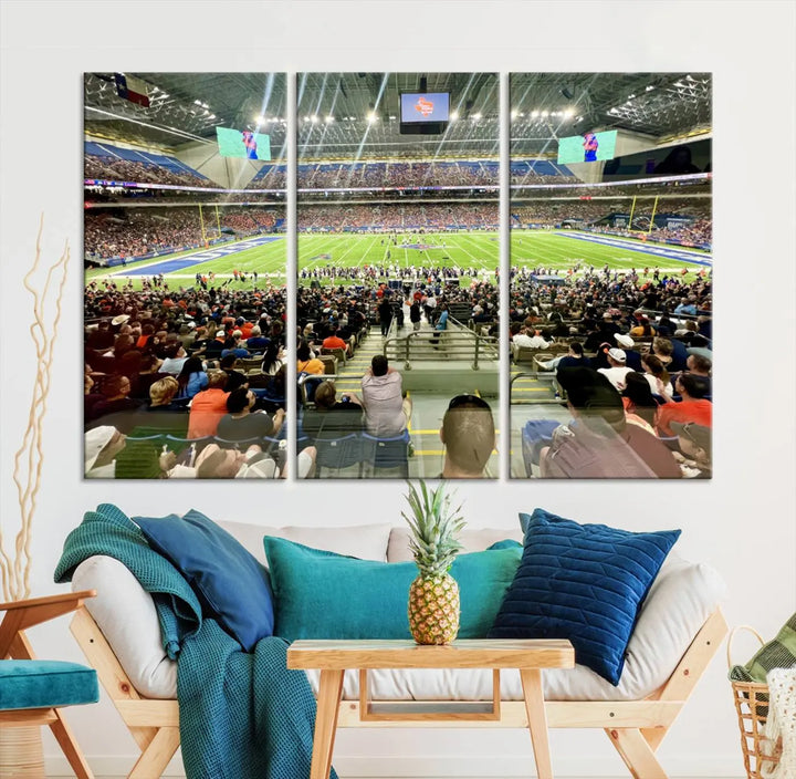 The living room features a large canvas print of the University of Texas at San Antonio Roadrunners football team, showcasing the San Antonio Alamodome. This museum-quality artwork enhances the space with its striking imagery.