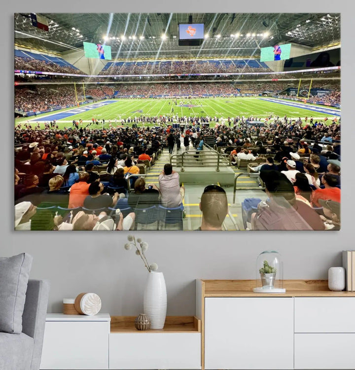 The living room features a large canvas print of the University of Texas at San Antonio Roadrunners football team, showcasing the San Antonio Alamodome. This museum-quality artwork enhances the space with its striking imagery.