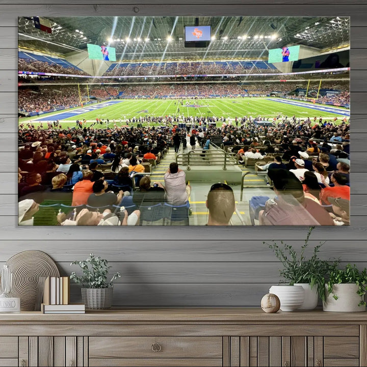 The living room features a large canvas print of the University of Texas at San Antonio Roadrunners football team, showcasing the San Antonio Alamodome. This museum-quality artwork enhances the space with its striking imagery.