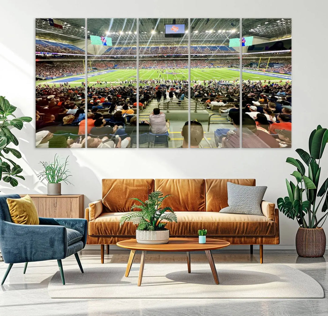 The living room features a large canvas print of the University of Texas at San Antonio Roadrunners football team, showcasing the San Antonio Alamodome. This museum-quality artwork enhances the space with its striking imagery.