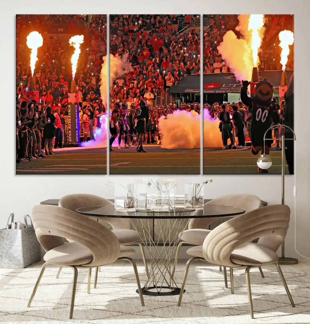 This museum-quality canvas, titled "The University of Texas at San Antonio Roadrunners Football Team Print - San Antonio Alamodome Wall Art Canvas Print," captures the intensity of a football game as players and a mascot charge through flames. The scene comes alive with high-resolution printing, crafted by professional artisans to bring a touch of excellence into your home.