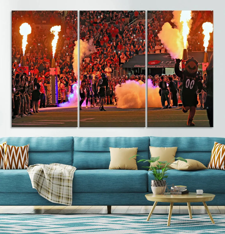 This museum-quality canvas, titled "The University of Texas at San Antonio Roadrunners Football Team Print - San Antonio Alamodome Wall Art Canvas Print," captures the intensity of a football game as players and a mascot charge through flames. The scene comes alive with high-resolution printing, crafted by professional artisans to bring a touch of excellence into your home.