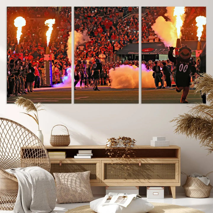 This museum-quality canvas, titled "The University of Texas at San Antonio Roadrunners Football Team Print - San Antonio Alamodome Wall Art Canvas Print," captures the intensity of a football game as players and a mascot charge through flames. The scene comes alive with high-resolution printing, crafted by professional artisans to bring a touch of excellence into your home.